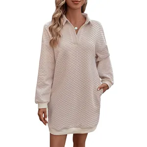 Beige quilted long sleeve polo neck dress with diamond texture and ribbed cuffs