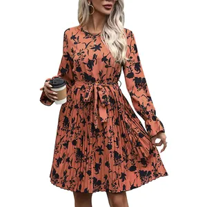Orange long sleeve pleated floral dress with waist tie and black flower pattern