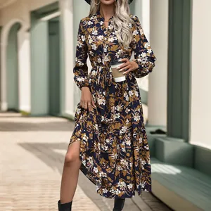 Deep blue vintage floral dress detail featuring elegant V-neck and drawstring waist