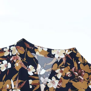 Detailed close-up of V-neckline on navy blue floral print chiffon dress for women