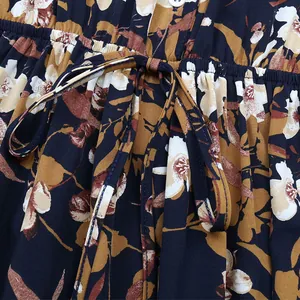 Detailed macro view of the drawstring waist and floral pattern on the vintage dress