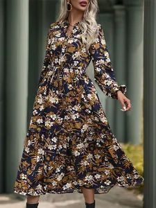 Elegant deep blue floral maxi dress with V-neck, long sleeves, and tiered skirt for women