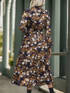 Elegant long sleeve floral midi dress with V-neck and ruffled hem in deep blue and yellow