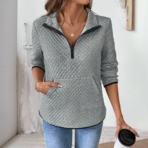 Women's grey waffle knit quarter-zip sweatshirt with diamond texture and front pocket
