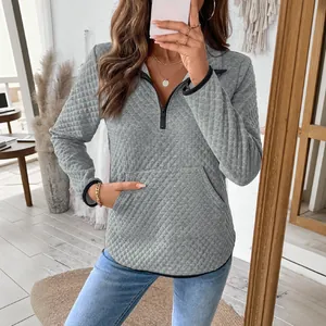 Women's light grey waffle knit half-zip pullover with diamond quilting and kangaroo pocket