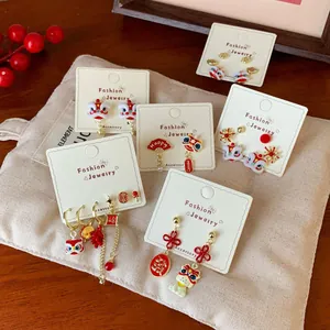 Festive Chinese New Year stud earring set with lion dance and fortune knot motifs