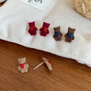 Three pairs of cute flocked teddy bear stud earrings with colorful scarfs for women