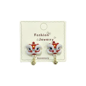Festive Chinese style lion dance earrings with red plush fur and gold bell pendants