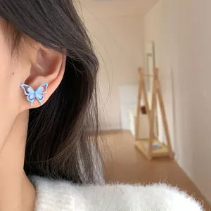 Light blue butterfly stud earrings with cat eye stones and silver pins for women