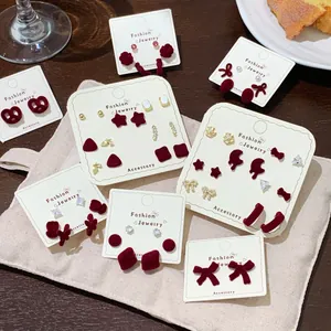 Red flocked heart and butterfly earring set for women featuring festive vintage style