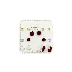 Retro red flocked heart and butterfly earrings set with six pairs of gold-tone jewelry