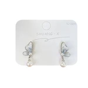 Blue gradient butterfly earrings with pearl drops and 925 silver needle on display card