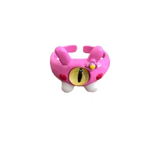 Pink cartoon monster open ring with yellow eye and enamel rabbit ears design