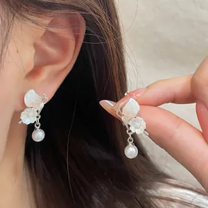 Elegant silver butterfly earrings with gradient crystals and white pearls for women