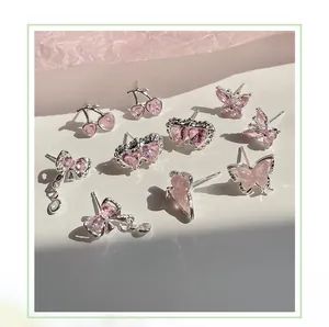 Detaillierte Nahaufnahme von rosa Zirkon-Kirsch-, Schmetterlings- und Herzohrsteckern