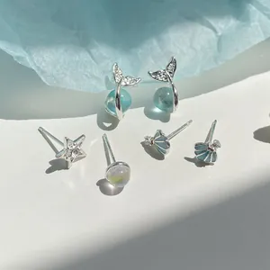 Set orecchini tema oceano con coda di pesce stella marina e conchiglia con perline