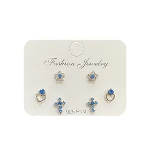 Set di tre paia di orecchini a lobo in argento 925 con strass blu e forme a croce e cuore