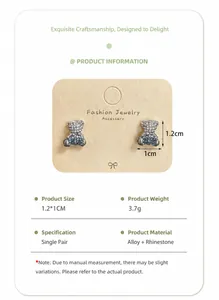Detailed size view of blue and white zircon teddy bear stud earrings on jewelry card