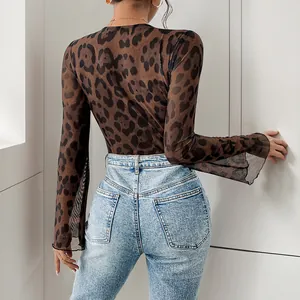 Back view of leopard print sheer mesh bodysuit with flared sleeves and blue jeans