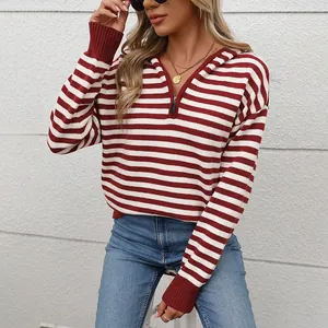 Detail view of the ribbed cuffs and classic red and white striped knit on this hoodie