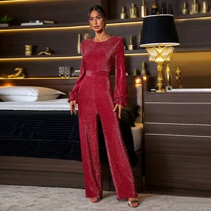 Detail of red sequin jumpsuit featuring ruffled sleeves and high-waist straight leg cut