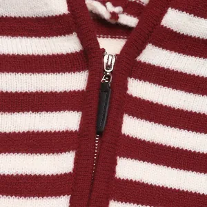 Detail of red and white striped knit sweater with premium silver metal zipper closure