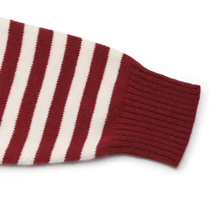Detailed macro view of the red and white striped knit sweater with ribbed cuffs