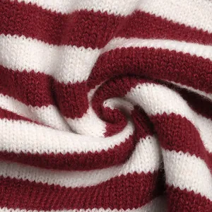 Close-up of red and white striped knit fabric showing soft texture and premium quality