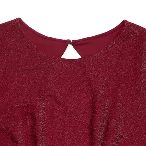 Detail of burgundy sequin jumpsuit featuring a keyhole back with a delicate round button