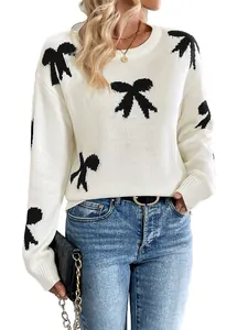 White crewneck knit sweater featuring casual black bow jacquard patterns for women
