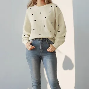 Cream crewneck sweater with black heart embroidery and relaxed fit for women