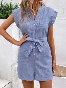 Detailed close-up of blue and white striped romper with waist tie and buttons
