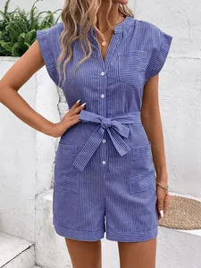 Close-up of blue striped romper featuring V-neckline with buttons and a tie waist belt