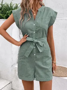 Close-up of green striped romper featuring V-neck, white buttons, and tie-waist detail