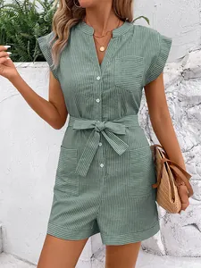 Detail of green pinstripe romper featuring utility pockets and adjustable waist tie