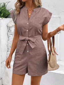 Detail of pinstriped romper featuring front buttons and adjustable drawstring waist