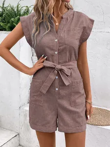 Detail of pinstripe romper with drawstring waist, chest pocket, and summer linen fabric