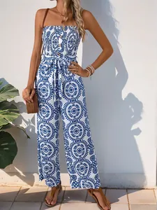 Mono palabra de honor chic con estampado de ondas azul y blanco y detalle de nudo en cintura