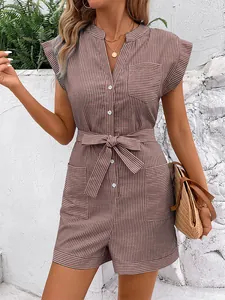 Detail of brown striped romper showing V-neck button closure and tie-waist belt