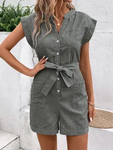 Detail of dark green striped romper showing button placket and waist tie tie design