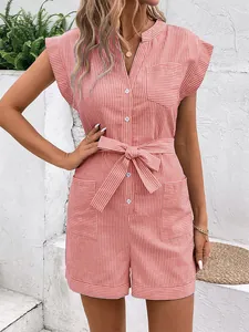 Detail of pink pinstripe romper featuring short sleeves, button placket, and waist tie
