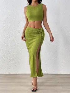 Detail of olive green ruched fabric and side slit design on a two-piece summer skirt set