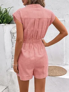 Detail of pink pinstripe romper showing elastic waist and back pleated texture