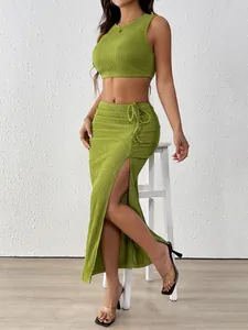 Detail of olive green ruched texture fabric and high side slit with drawstring on skirt