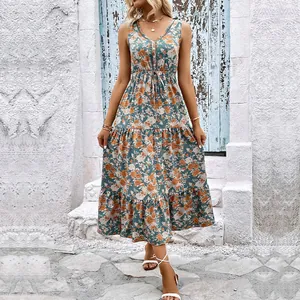 Robe mi-longue sans manches à fleurs bleu canard avec détails de jupe à volants