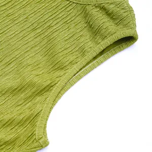 Detail of olive green ruched fabric showing textured stitching and seamless finish