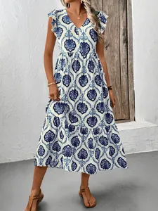 Robe longue bohème pour femme avec col en V profond et imprimé floral bleu sur coton blanc