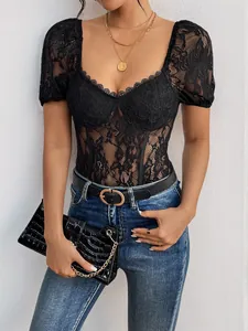 Detail of floral black lace fabric with elegant square neckline and puff sleeves