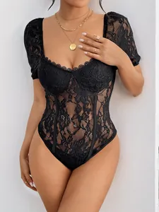 Detailed close-up of a black lace bodysuit with square neckline and floral embroidery