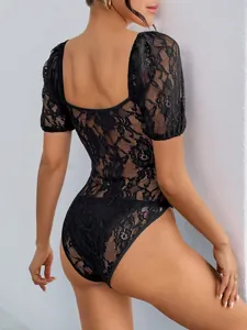 Detail shot of intricate floral lace texture on back of black square neck bodysuit